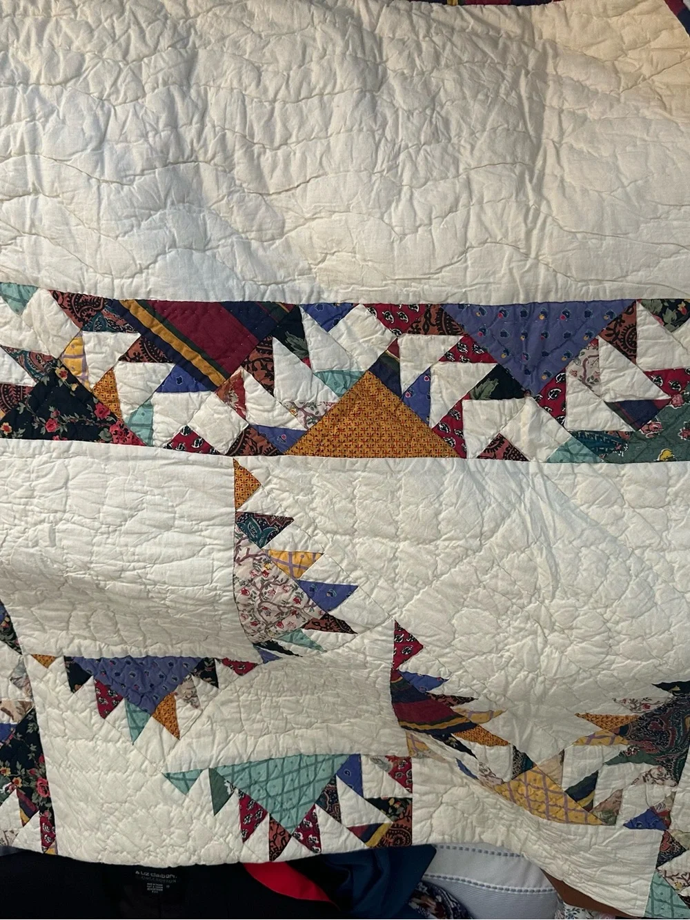 Cream Patchwork Quilt with Multicolor Triangle Ring Design